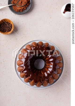 Chocolate marble bundt cake with chocolate glaze drizzled on top 106155567