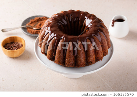 Chocolate marble bundt cake with chocolate glaze drizzled on top Chocolate marble bundt cake with chocolate glaze drizzled on top 106155570