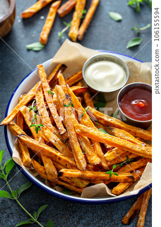 Sweet potato fries with sauces 106155594
