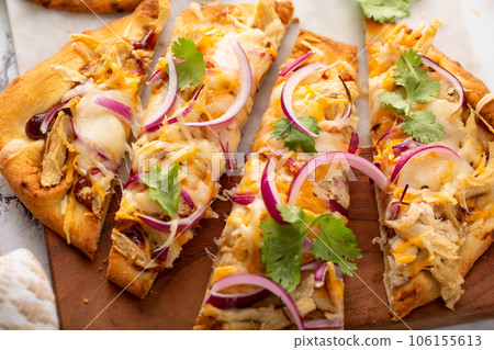Barbeque chicken flatbread with cheese and red onion 106155613