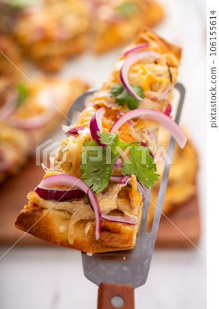 Barbeque chicken flatbread with cheese and red onion 106155614