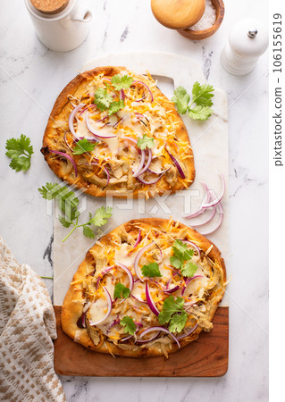 Barbeque chicken flatbread with cheese and red onion Barbeque chicken flatbread with cheese and red onion 106155619
