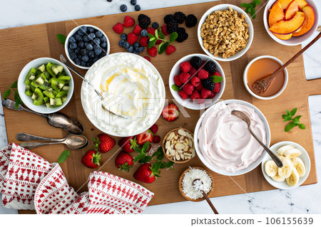 Yogurt bowl bar, big board with different toppings Yogurt bowl bar, big board with different toppings 106155639