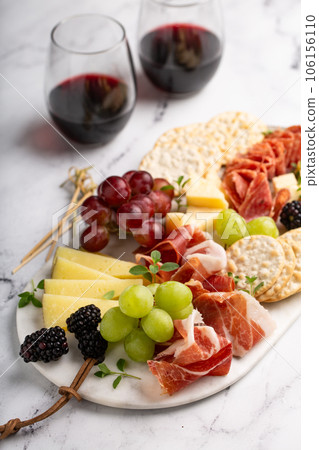 Charcuterie board with variety of cheese and meat 106156110