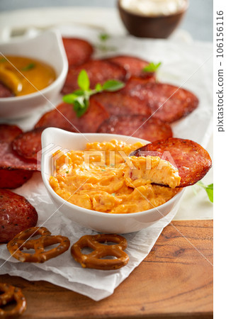 Salami chips baked in the oven with cheese sauces Salami chips baked in the oven with cheese sauces 106156116