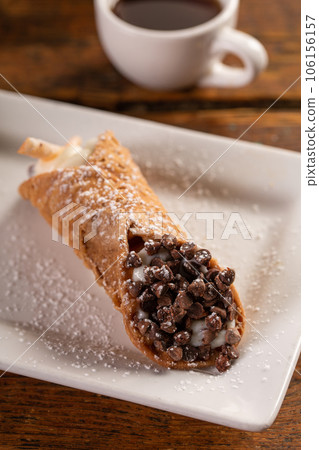 Traditional italian desserts cannoli on the plate 106156157