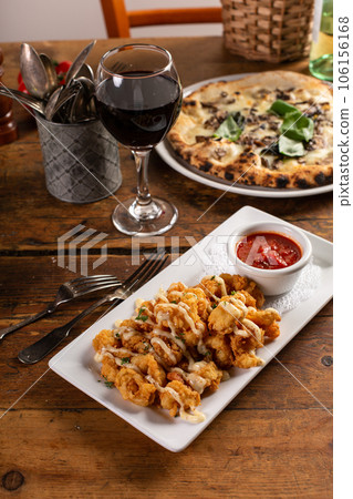 Popcorn shrimp appetizer with marinara sauce 106156168