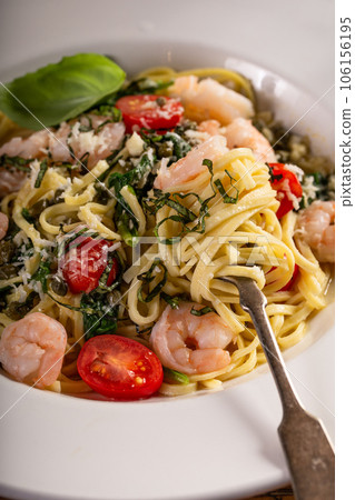 Fresh pasta linguine with shrimp and tomatoes Fresh pasta linguine with shrimp and tomatoes 106156195