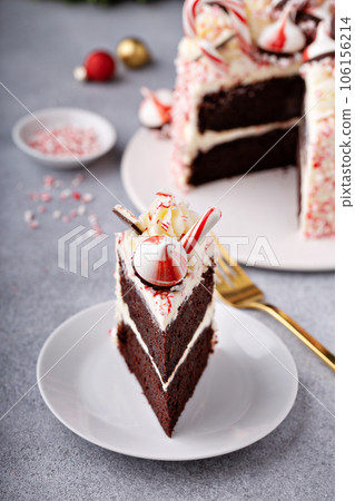 Peppermint bark and chocolate cake for Christmas on a festive background 106156214