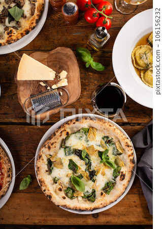 Pizza bianca or white pizza with artichokes and basil 106156232