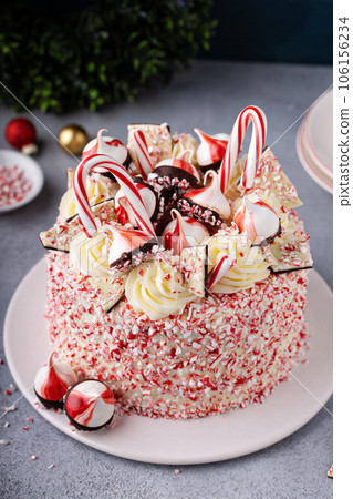 Peppermint bark and chocolate cake for Christmas on a festive background 106156234