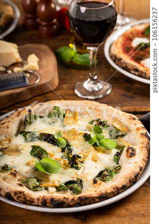 Pizza bianca or white pizza with artichokes and basil 106156237