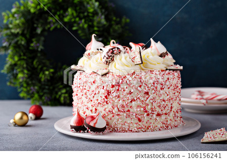 Peppermint bark and chocolate cake for Christmas on a festive background Peppermint bark and chocolate cake for Christmas on a festive background 106156241