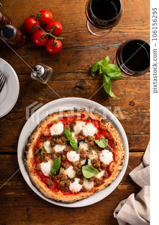 Freshly baked Neapolitan pizza with mozzarella and basil 106156295