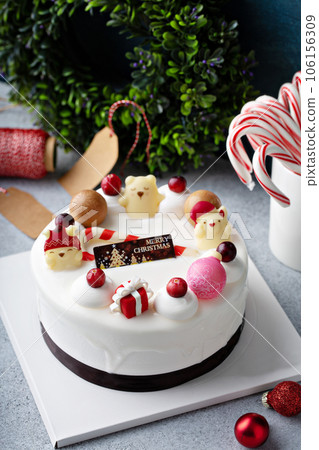 White chocolate Christmas celebration cake with holiday decorations 106156309