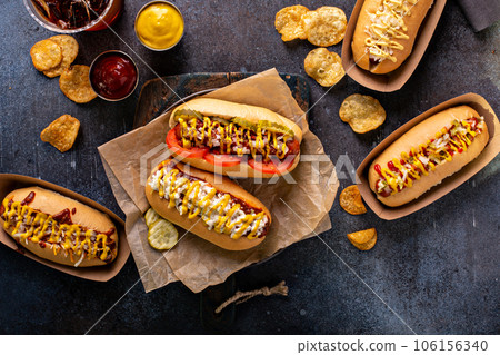 Variety of hot dogs with ketchup and mustard Variety of hot dogs with ketchup and mustard 106156340