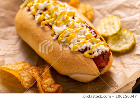 Chili hot dog with onion and mustard Chili hot dog with onion and mustard 106156347