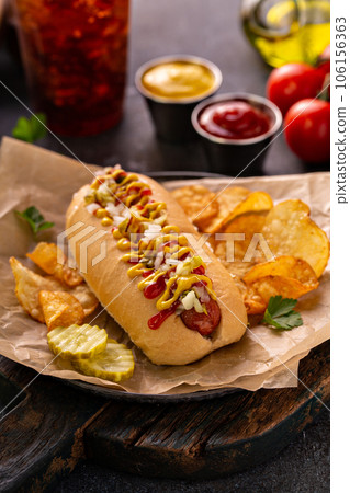 Traditional american hot dog with mustard and ketchup Traditional american hot dog with mustard and ketchup 106156363