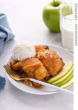 Apple dumplings in flaky pastry with caramel sauce Apple dumplings in flaky pastry with caramel sauce 106156429