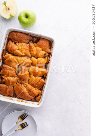 Apple dumplings in a baking dish, fall dessert Apple dumplings in a baking dish, fall dessert 106156437