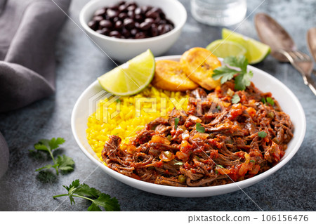 Ropa vieja, flank steak dish with rice 106156476