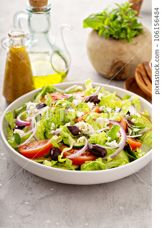 Fresh vegetables and feta greek salad with homemade dressing 106156484
