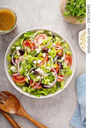 Fresh vegetables and feta greek salad with homemade dressing 106156485