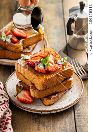 French toasts with strawberry and powdered sugar French toasts with strawberry and powdered sugar 106156518