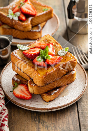 French toasts with strawberry and powdered sugar 106156521