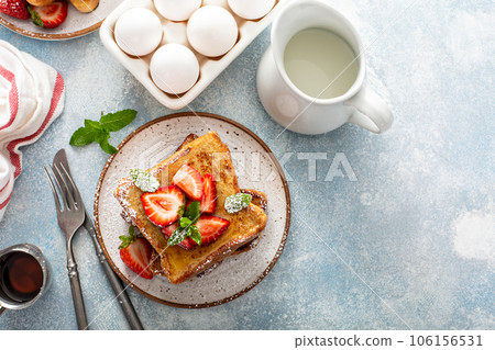 French toasts with strawberry and powdered sugar 106156531