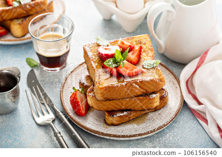 French toasts with strawberry and powdered sugar French toasts with strawberry and powdered sugar 106156540