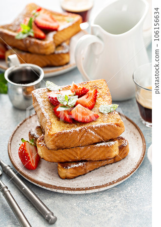 French toasts with strawberry and powdered sugar French toasts with strawberry and powdered sugar 106156634
