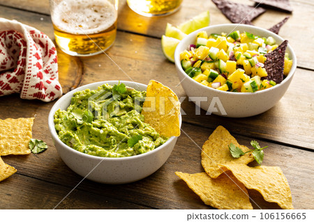 Tortilla chips with dips, guacamole and salsa 106156665