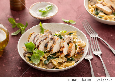 Grilled chicken with mushroom and spinach pasta Grilled chicken with mushroom and spinach pasta 106156697
