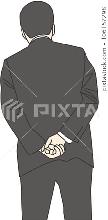 A man in a suit with his hands behind his back 106157298