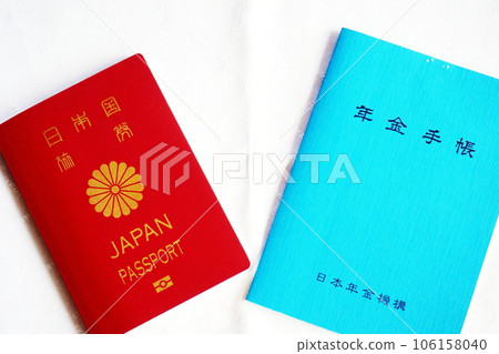 Passport, pension handbook, and identification cards lined up against a white background Passport, pension handbook, and identification cards lined up against a white background 106158040