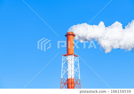 A clear sky and a chimney that raises white smoke A clear sky and a chimney that raises white smoke 106158539