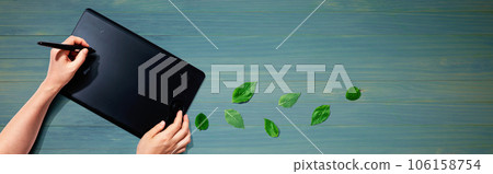 Graphic pen tablet with green leaves 106158754