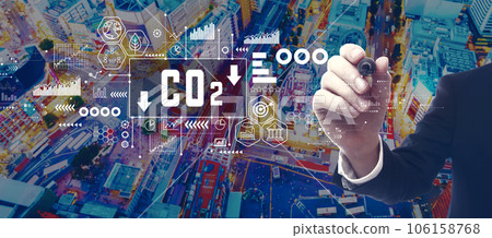 Reduce CO2 theme with businessman in city at night Reduce CO2 theme with businessman in city at night 106158768