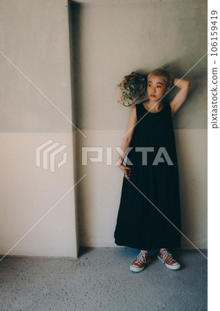 young woman standing indoors young woman standing indoors 106159419