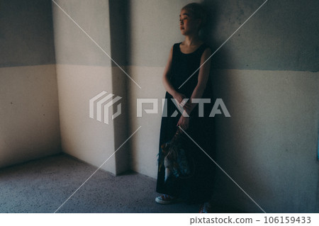 young woman standing indoors young woman standing indoors 106159433