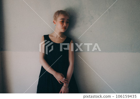 young woman standing indoors young woman standing indoors 106159435