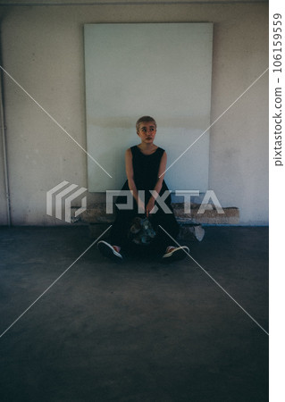 A woman standing indoors with dried flowers A woman standing indoors with dried flowers 106159559