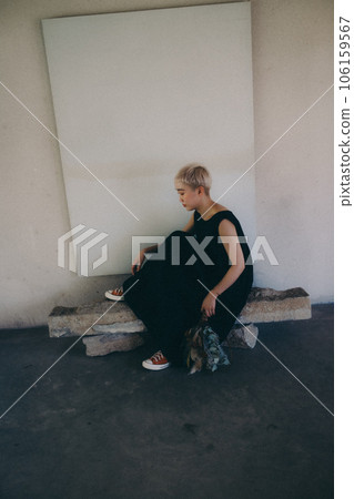 A woman standing indoors with dried flowers A woman standing indoors with dried flowers 106159567