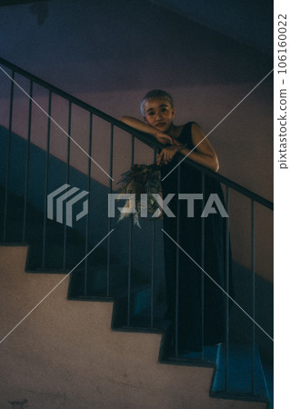 young woman standing on the stairs young woman standing on the stairs 106160022