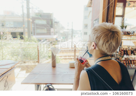 young woman standing in a cafe young woman standing in a cafe 106160073