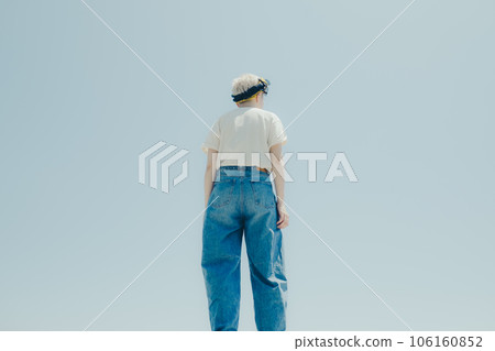 A woman standing in an empty background A woman standing in an empty background 106160852