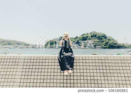 A woman standing in an empty background 106160861