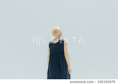 A woman standing in an empty background 106160878