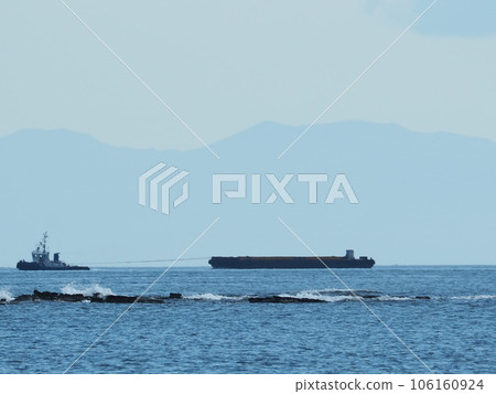 Tanker being towed by a tugboat Tanker being towed by a tugboat 106160924